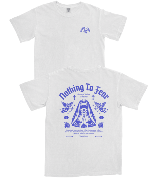 Two white short-sleeve T-shirts shown on a plain white background, with the front view above and the back view below. The back has a large blue graphic with the text 'Nothing To Fear' and a central illustrated figure, while the front has a smaller matching blue chest graphic.