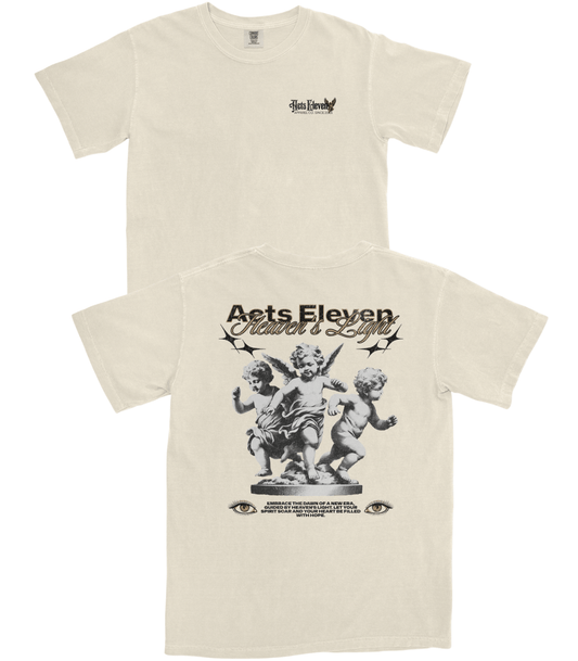 Front and back views of an off-white short-sleeve t-shirt. The front features a small black graphic on the left chest, and the back features a large black graphic of cherubs with the text 'Acts Eleven' and 'Father's Day'.