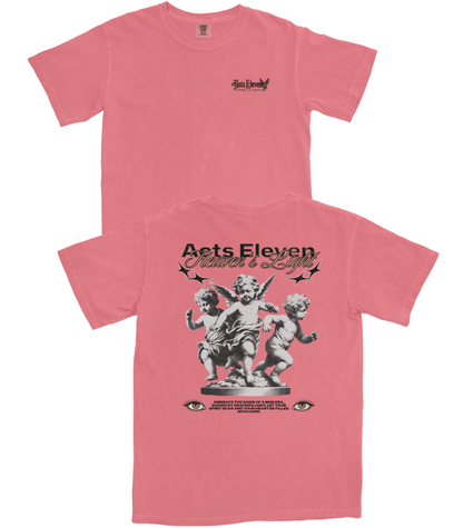 A pink short-sleeve graphic t-shirt shown from both the front and back. The front features a small black 'Acts Eleven' logo on the left chest.