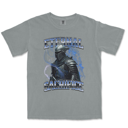 A light gray crewneck t-shirt featuring a graphic print of a knight in dark armor with blue lightning effects and the words 'ETERNAL SACRIFICE' in a stylized blue and white font.