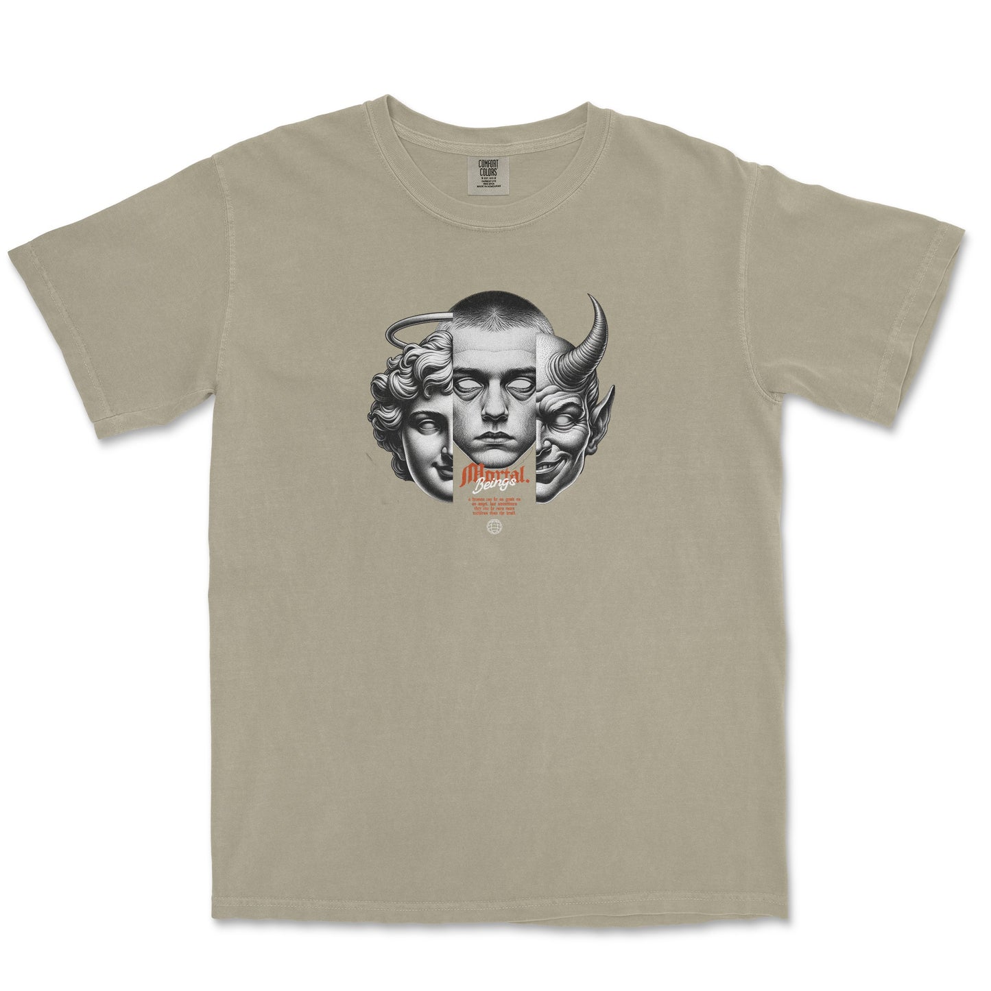 A beige crewneck t-shirt featuring a central graphic print of three stylized faces (a human face, a goat head, and a horned demon face) in gray, with small orange text below.