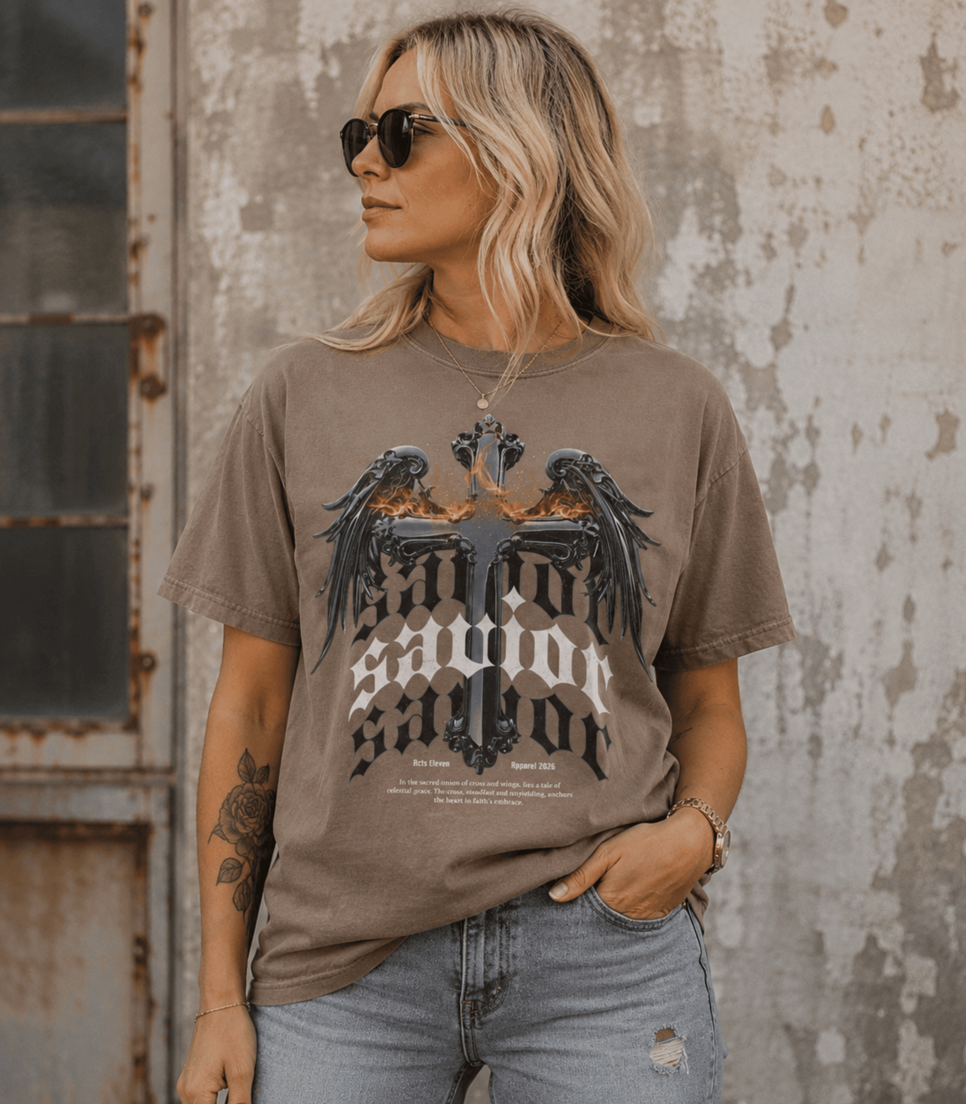 A woman wearing a brown graphic t-shirt with 'Honor. Servant.